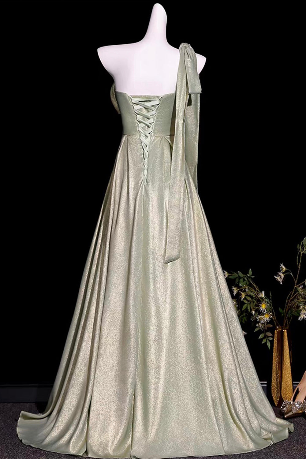 Sage Green Metallic One-Shoulder Gown with Sculptural Bow & Trailing Ribbon
