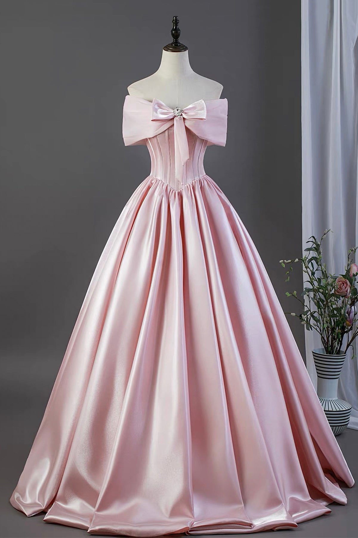 Pink Satin Off-the-Shoulder Ball Gown with Bow Detail – Elegant Formal Dress for Prom