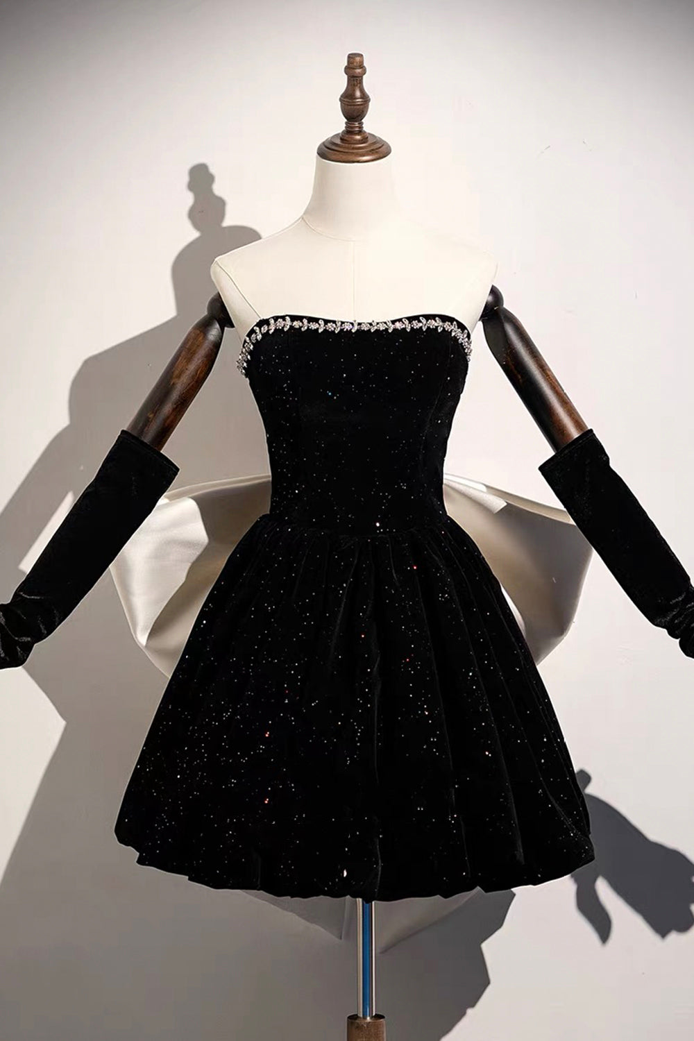 Black Sparkle Velvet Off-Shoulder Mini Dress – Crystal Neckline with Oversized White Satin Bow Back