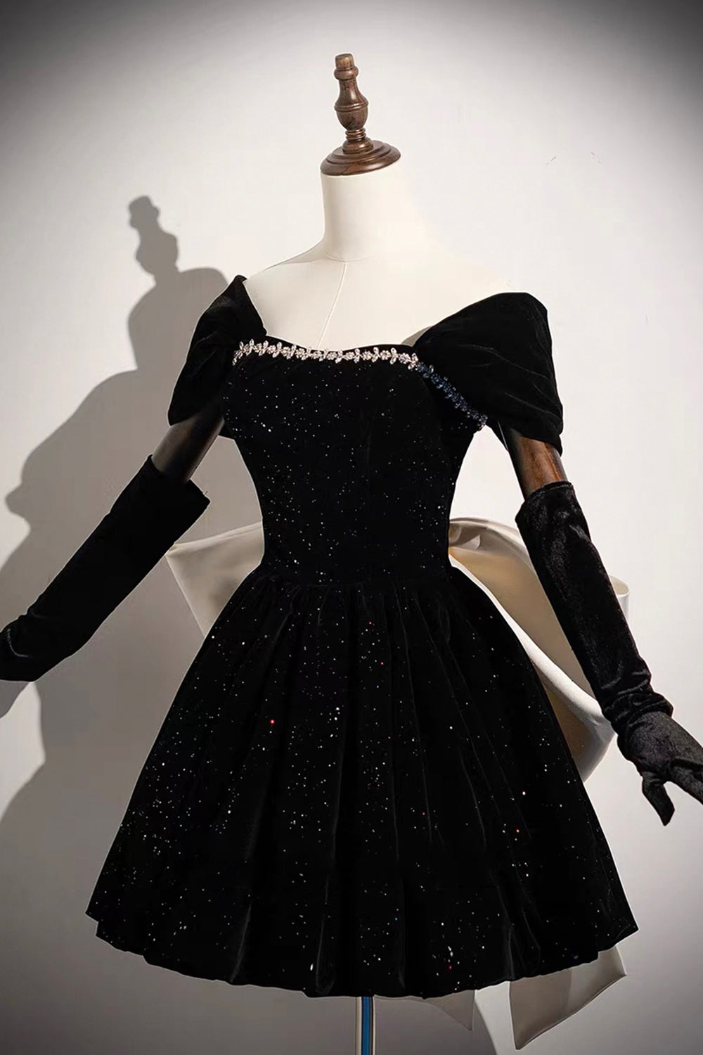Black Sparkle Velvet Off-Shoulder Mini Dress – Crystal Neckline with Oversized White Satin Bow Back