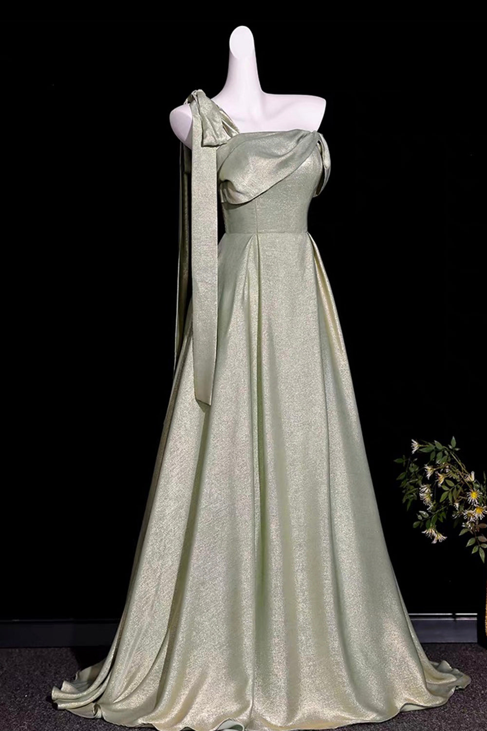 Sage Green Metallic One-Shoulder Gown with Sculptural Bow & Trailing Ribbon